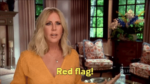 Vicki from the real housewives of orange county says red flag and waves her arms