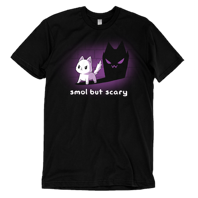 A tshirt with an illustrated cat throwing a very scary shadow with the caption SMOL BUT SCARY