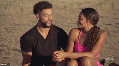 Michelle and Jamie talk on top of the rock formation they climbed