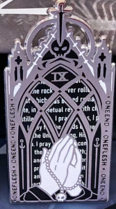 A gothic window with the text form Prayer of the Ninth House: one end one flesh with hands in a prayer position below skulls it's freaking wild