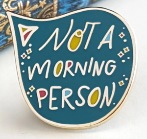 A blue text bubble with multicolored letters that say Not a Morning Person