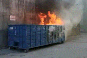 A dumpster burns