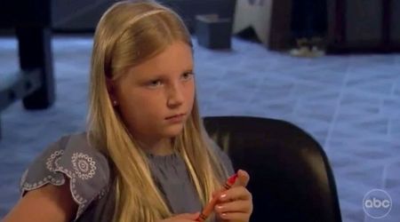 Kelsey stares ahead blankly