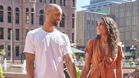 Joe and Michelle hold hands.