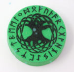 Witch baby bath bomb in green with yggdrasill and runes around the border