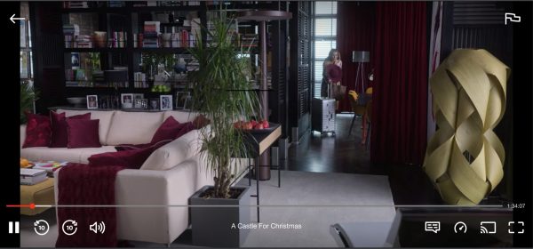 Light filled penthouse with a large wood sculpture