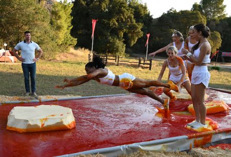 The women run down a messy obstacle course.