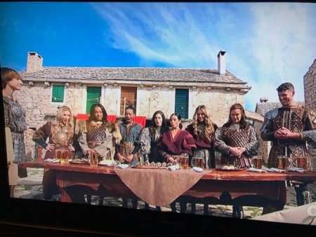 The women stand in front of a banquet table