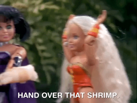 A female action figure says hand over the shrimp and another action figure slaps her with a shrimp