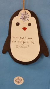 A close up of a epnguin cutout of paper that reads Why don't you see penguins in Britain?