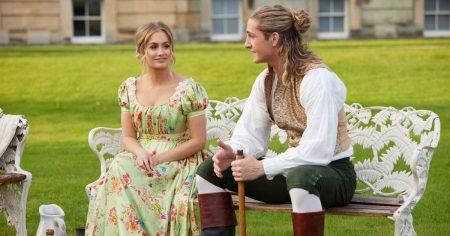 Ms. Cleary sits on a bench with Mr. Saffa