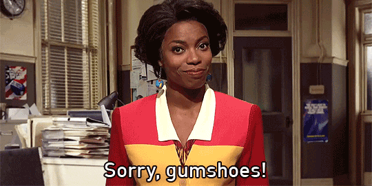 SNL cast member Sasheer Zamata in a skit riffing on beloved edutainment tv show Where in the World Is Carmen Sandiego? Sasheer, as The Chief, says sorry gumshoes!