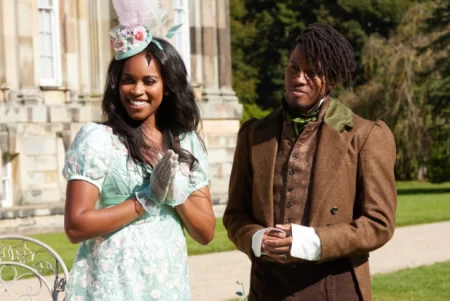 Nicole stands next to her brother