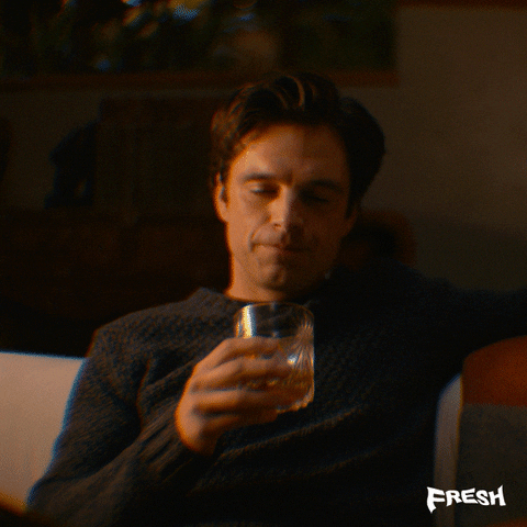 Steve drinks smugly form his glass and then becomes blurry