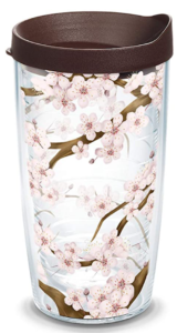 A double walled plastic tumbler with cherry blossoms and a brown plastic lid