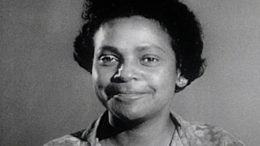 a black and white photo of young Faith Bandler smiling at the camera