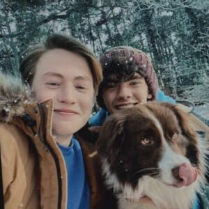 Charlie, Nick, and Nellie (a brown and white dog)
