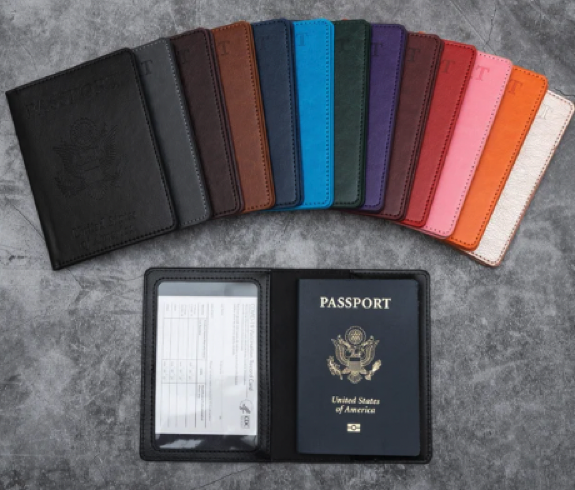 Leather wallet for passport on one side and a clear sleeve for a vaccination card on the other