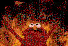 The famous elmo-looking puppet with its arms up against a fiery background 