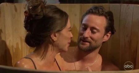 Gabby and Johnny sit in a tub of beer