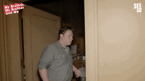 A clip from my brother my brother and me where a dude opens a door to a room filled with stuff and says It's Trash
