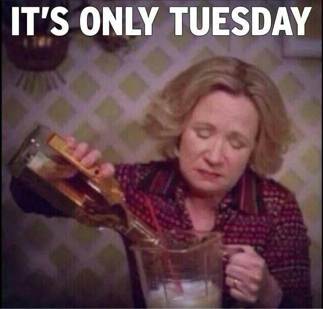Woman pouring an entire bottle of tequila in a blender with a straw and the caption It's Only Tuesday