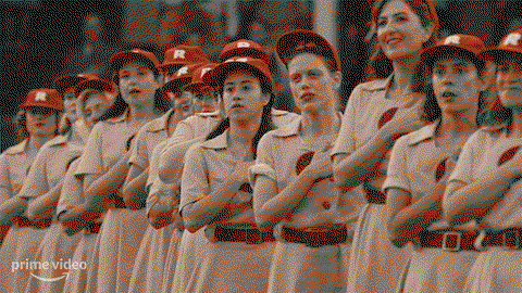 The Rockford peaches with their hands on their hearts for the national anthem 