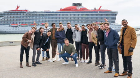 The guys and Dale pose in front of the ship