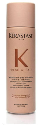 A peach colored bottle of dry shampoo