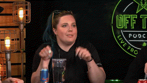 A woman points at the table with grabby hands and says It's Mine Now