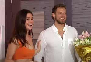 Erich holds flowers as he meets Gabby's family