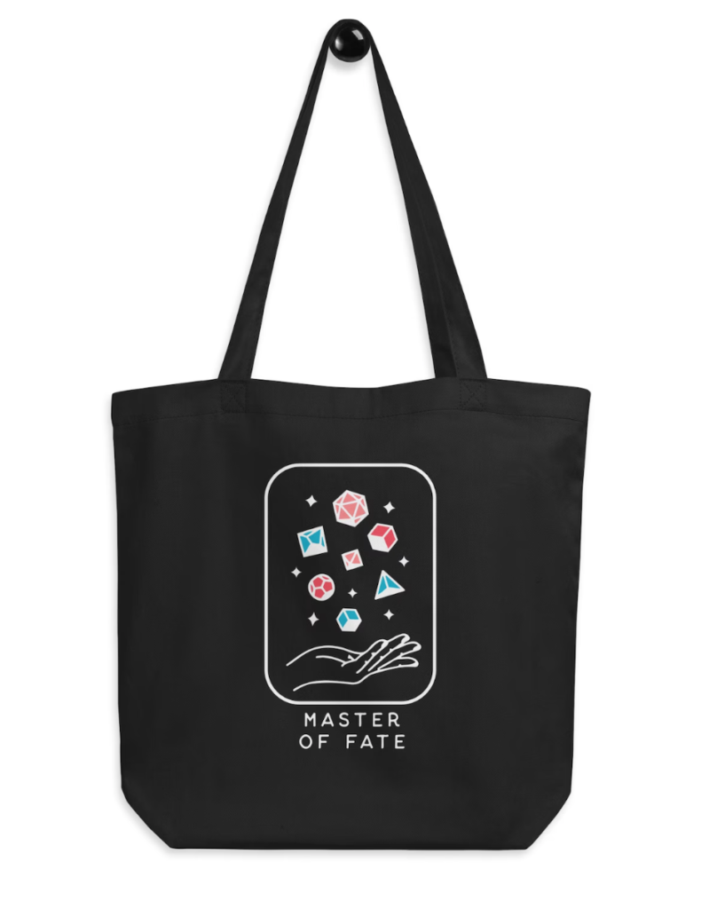 Master of Fate Tote Bag. A black tote bag with an image made to look like a tarot card. There's an outstretched hand with seven colorful D&D dice falling into its palm. The bottom reads Master of Fate.