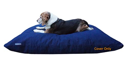 A blue denim dog med with a very old beagle dog lounging on it