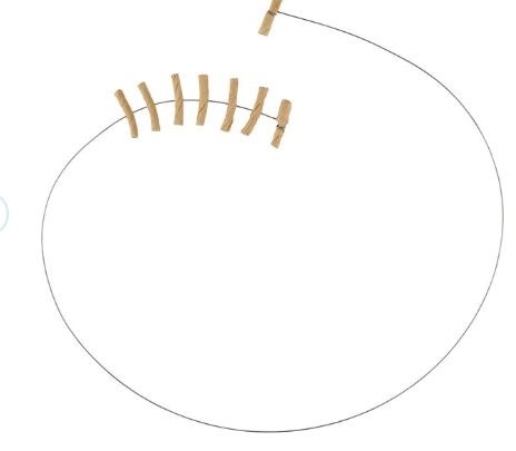 A wire cat toy with rolled bits of cardboard on the ends