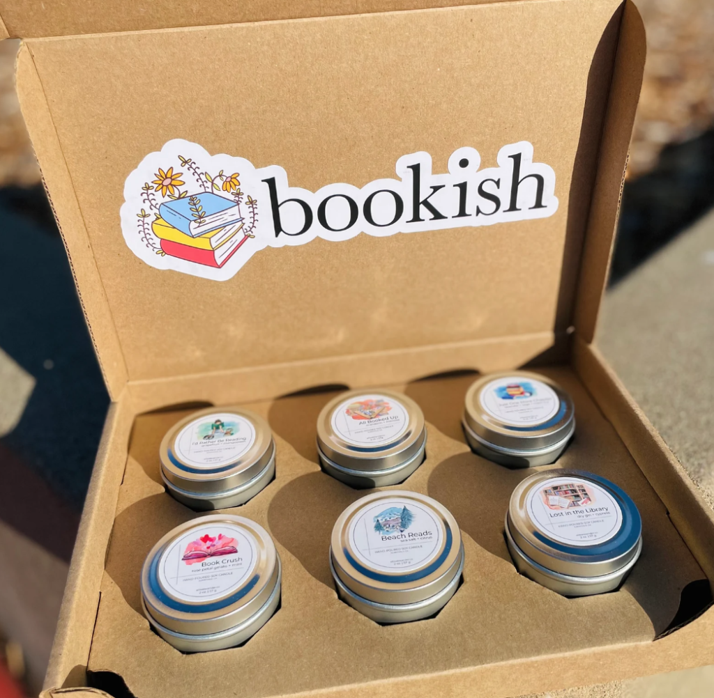 Bookish Candle Box by Ellie Alexander. Six metal tins in a cardboard box.