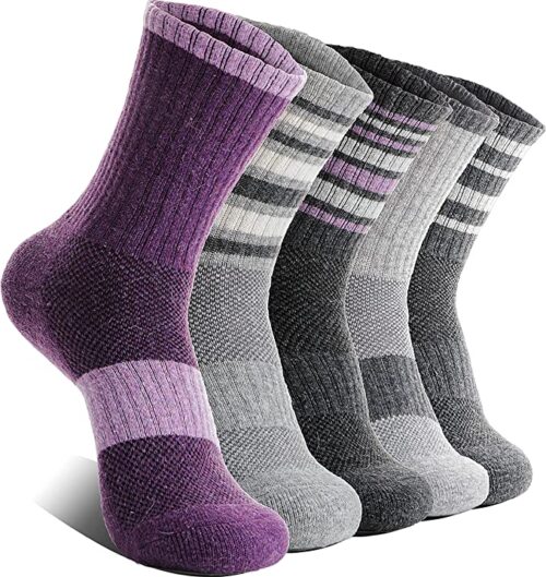 A line up of five styles of wool sock with a purple in the front and grey and purple stripes on the other four 