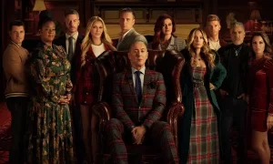 Alan Cumming and the reality show cast members of the Traitors sit for a somber portrait