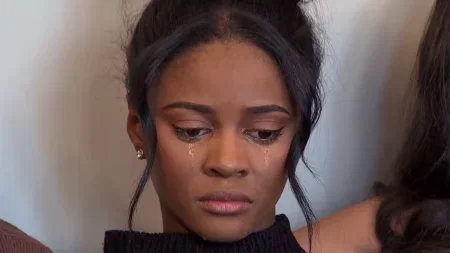 a close up of Charity crying