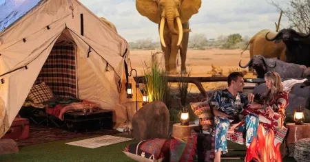 Zach and Kaity cuddle up outside their tent
