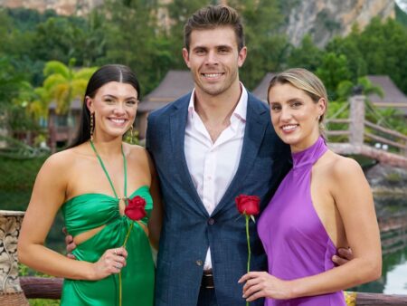 Gabi and Kaity stand on either side of Zach, each holding a rose