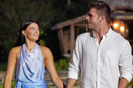 Gabi and Zach walk hand in hand.