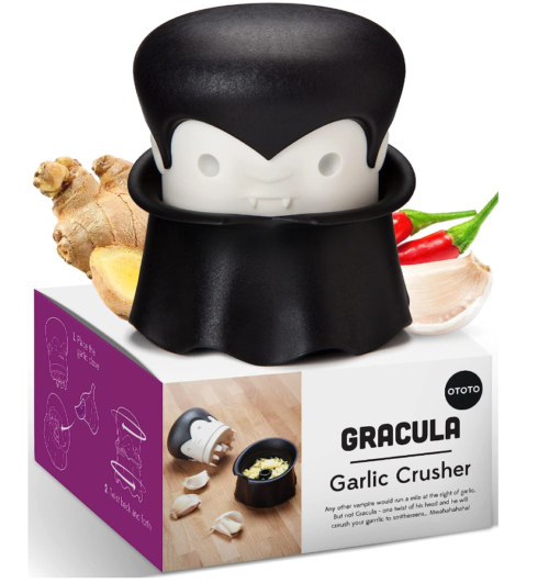 Gracula the garlic crusher. His head is the bladed crushing mechanism and it sits in his cape, which has an area for garlic gloves. Twist to crush and enjoy!