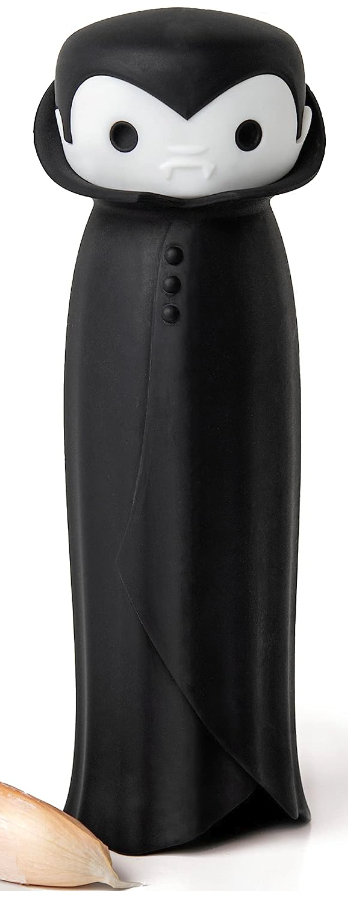 A black rubber garlic peeler tube shaped like a cape with a vampire head on the top 