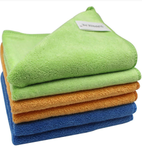 Microfiber towels in green, orange, and blue, in a stack