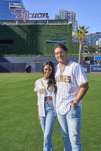 Brayden and Charity wear their baseball jerseys