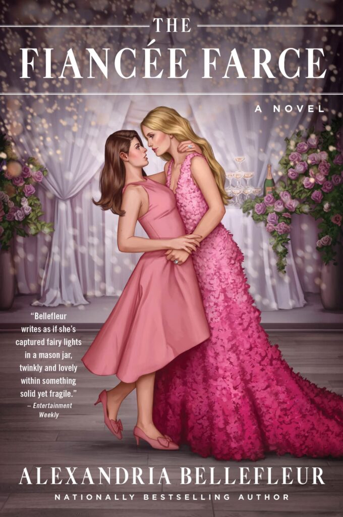 The Fiancee Farce by Alexandria Bellefleur. An illustrated cover with two women embrace. The blonde woman is on the right and looks like she wants to dip the brunette. She is wearing a pink ombre, floor-length dress with lots of ruffles. The brunette is wearing a soft pink, high-low dress with kitten heels. Both dresses are sleeveless. The background has gauzy curtains, fairy lights, and two big arrangements of pink and white flowers. 