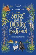 Secret Lives of Country Gentlemen by KJ Charles. A blue cover. In the bottom middle is an illustration of two men crouched together. One is in blue and grey with blonde hair while the other has dark hair and is dressed in black and charcoal. In the background is a small house. The borders have all sorts of plants and wildlife - vines, trees, a fox, a rabbit, a snake, and a stork.