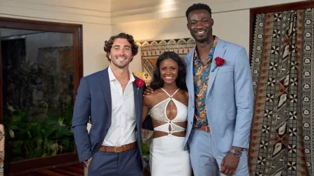 Charity stands in between Joey and Dotun. Dotun is like six feet seven inches tall