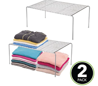 Perforated metal shelves with thin legs and rubber tips on the bottom The ones pictured have folded sweaters on them. 