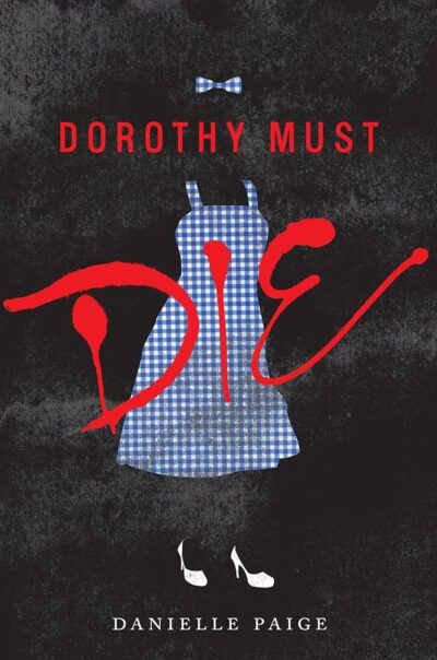 Dorothy Must Die an outline of a blue gingham pinafore dress, white heels and a gingham hairbow, with Dorothy must DIE written in red on top 